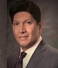 Dr. Moses Chandran